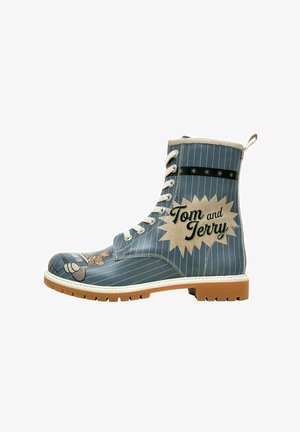 Blue leather boot with white pinstripes, featuring Tom and Jerry graphics, a cream sole, and round laces. Accented with a black band.