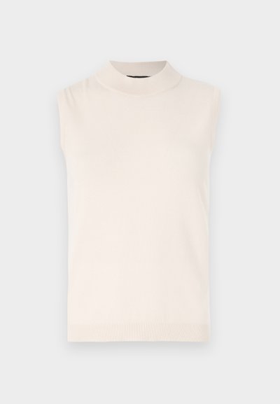 Sleeveless cream-colored knit top with a high collar and ribbed hem. Soft texture and fitted design, suitable for layering or standalone wear.