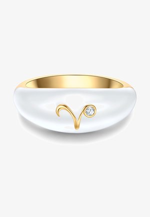 Bela keramična prstana z gladko površino, zlatim notranjim delom in zlatim simbolom ovna, okrašenim z majhnim prozornim kamnom.