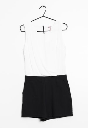 Rompers noir et blanc avec un haut sans manches et un bas court. Le matériau semble lisse avec une fermeture éclair au dos. Deux poches latérales.