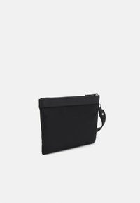 Black fabric clutch bag with smooth texture, zippered top, and a side handle for carrying. Simple rectangular design, no visible patterns or embellishments.