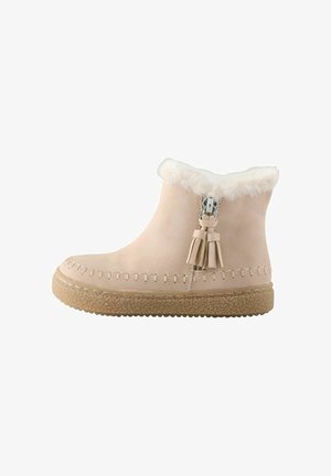 Helle beige Stiefeletten mit einem weichen Fellkragen, dekorativen Quasten, gestickten Details und einer strukturierten Gummisohle.