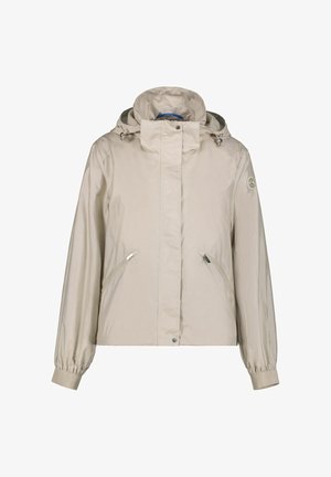 Giacca con cappuccio color beige chiaro con polsini elasticizzati, chiusura frontale con cerniera, due tasche laterali con cerniera e patch con logo sulla manica sinistra.