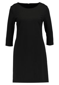 Robe noire longueur genou avec manches trois-quarts et encolure ronde, dotée d'une fermeture éclair au dos.