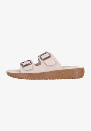 Beige slide sandals med to justerbare sølvspænder, lavet af blødt suede-lignende materiale, med en struktureret korksål for bedre greb.