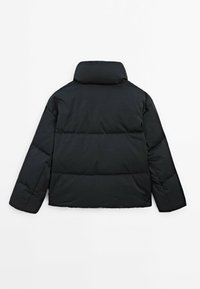 Black puffer jacket with a high collar, quilted pattern, and long sleeves. Smooth, shiny fabric with a cropped silhouette.