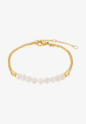 Zlatý náramok s radom šiestich bielych perál, zabezpečený pomocou klipsne na homáry a nastaviteľného predlžovacieho reťazca.