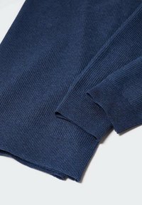 Navy blue ribbed sweater fabric with long sleeves and textured cuffs. The material appears soft with a smooth finish. No visible patterns.