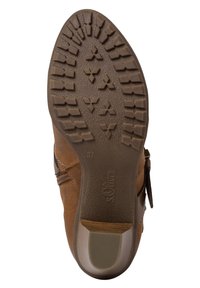 Bottine marron avec une semelle en caoutchouc texturé, fermeture éclair latérale et détails de couture. Taille 37 indiquée sur la semelle. Design à talon plat.