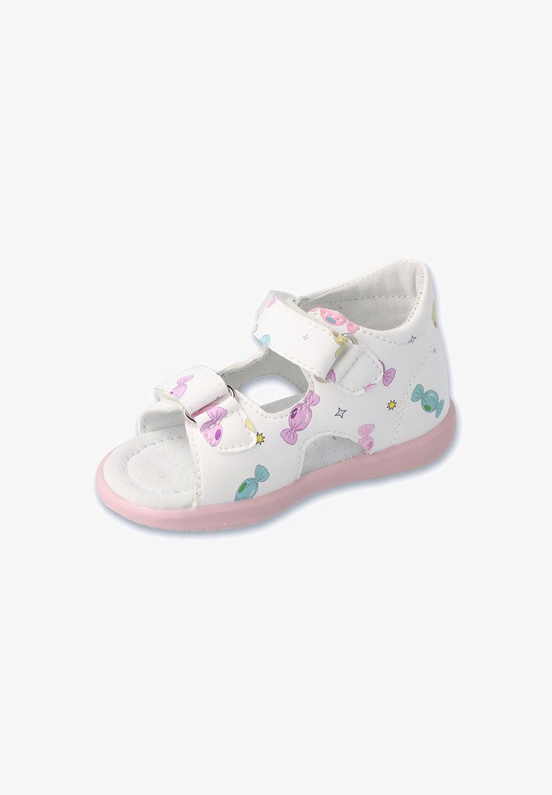 Białe sandały z różową podeszwą, ozdobione wzorami w tematyce cukierkowej w pastelowych kolorach. Wykonane z materiału syntetycznego, z dwiema regulowanymi paskami na rzepy.