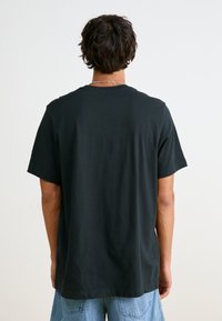 Nike Sportswear TEE FUTURA - T-shirts print - black