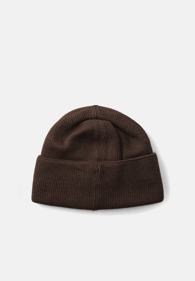 Brown ribbed knit beanie with a folded cuff. Soft texture, rounded top, and even stitching. Suitable for casual wear in cooler weather.