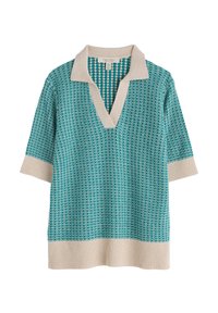 V-hihainen, lyhythihainen neulepusero turkoosina, jossa on kuviollinen design. Kermanvärinen kaulus ja ribbireuna. Kevyt neuletekstuuri.