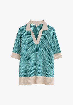 Teal krāsas īsām piedurknēm adīta džemperis ar rakstainu dizainu, ar krēmkrāsas apkakli un ribinātu apakšmalu. V-veida kakla dekoltē. Viegls adījuma tekstūras materiāls.