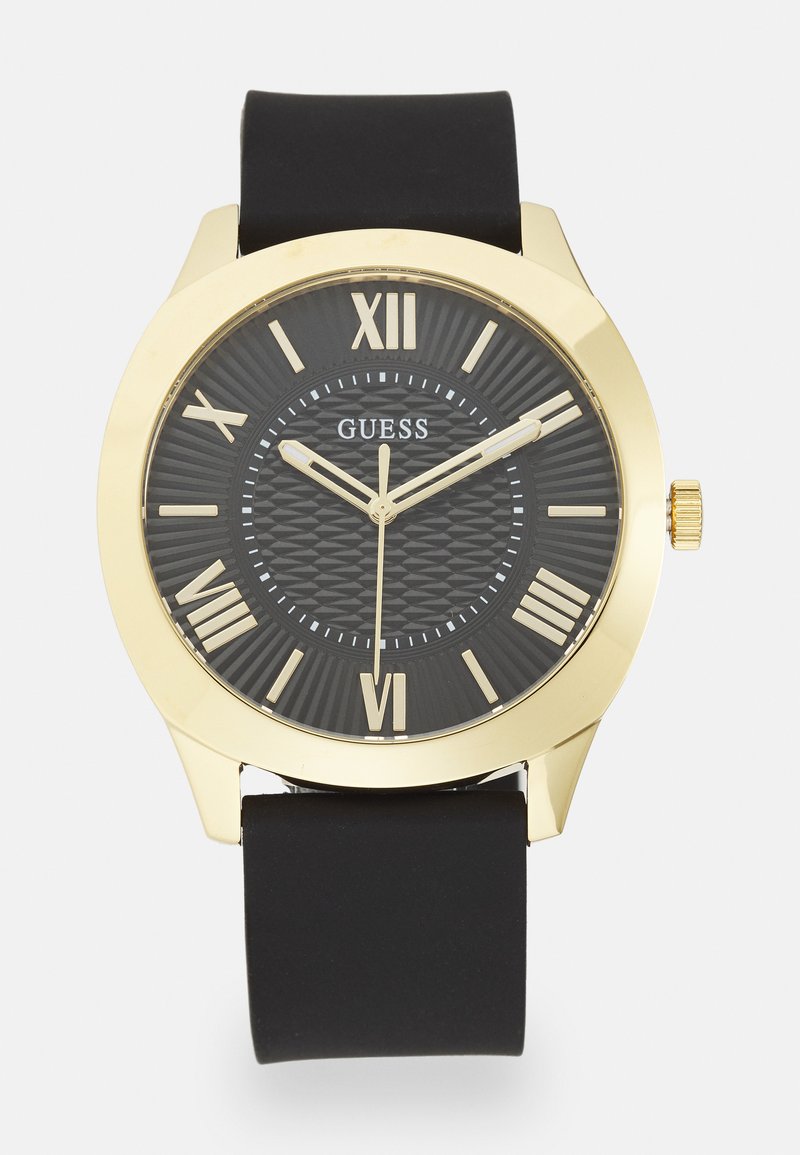 Schwarze Uhr mit einem runden Gehäuse aus goldfarbener Legierung, strukturiertem schwarzen Ziffernblatt, römischen Ziffern als Markierungen und einem schwarzen Gummiarmband. Goldene Akzente auf den Zeigern.