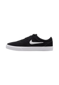Black suede sneakers with white rubber sole and swoosh logo, featuring a low-top design and classic lace-up closure.
