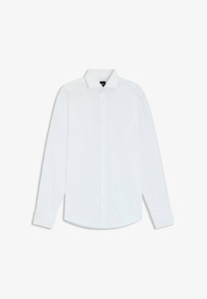 Chemise blanche à manches longues boutonnée avec col pointu et poignets, étalée à plat sur fond blanc.