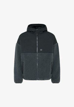Fleece-fôret jakke med en svart, glatt øverste del og grå, strukturert nederste del. Har hette, glidelås og sidelommer.