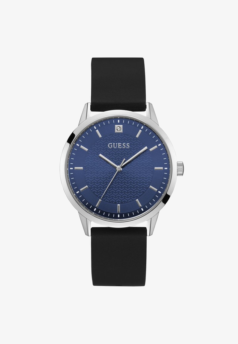 Blaue Zifferblatt-Uhr mit strukturiertem Muster, silbernem Gehäuse, schwarzem Gummiband sowie silbernen Stundenmarkierungen und Zeigern. Markenlogo angezeigt.