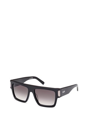 Lunettes de soleil noires avec un design carré, des verres dégradés et des accents en métal argenté. Présente le logo "MCM" sur un bras.