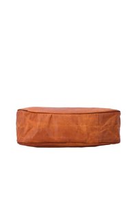 Rectangular brown leather cushion with visible creases and stitching, viewed from the side against a white background.