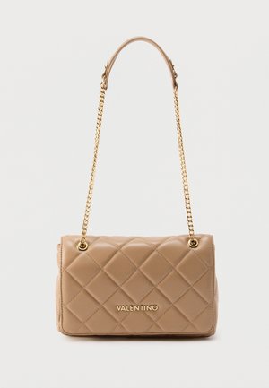 Beige quilted leather handbag with a gold chain strap and logo detail. Features diamond-patterned texture and a rectangular shape.