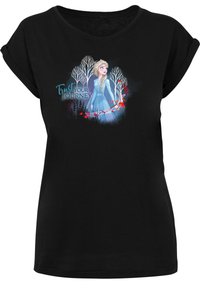 Juoda trumpa rankovė t-shirt su grafika, vaizduojančia personažą mėlynoje suknelėje tarp baltų medžių, su tekstu "Pasitikėk savo kelione."