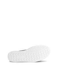Suola delle scarpe in gomma bianca con una superficie texturizzata e puntini rotondi. La parte superiore è di un colore solido, probabilmente viola.