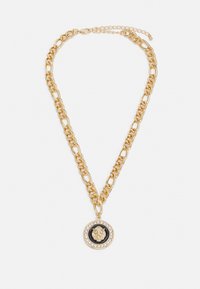 Gold chain necklace with large circular pendant featuring a lion design in the center, surrounded by clear gemstones on a black background.