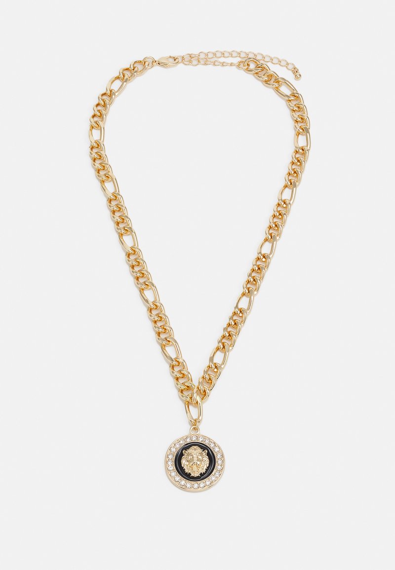 Gold chain necklace with large circular pendant featuring a lion design in the center, surrounded by clear gemstones on a black background.