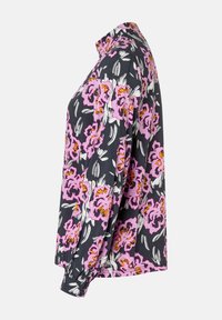 Floral blouse featuring a dark background with pink and orange flowers. Long sleeves, button-up collar, and soft fabric texture.