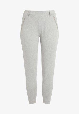 Leggings gris en tissu doux et extensible. Dotés d'une taille élastique et de deux poches zippées à l'avant. Design de jambe fuselée.