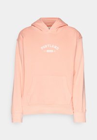 Helles rosa Hoodie mit einer Vordertasche, Kapuze mit Kordelzug und weißem Text "PORTLAND 1986 U.S.A." über der Brust. Weicher Stoff mit gerippten Bündchen.