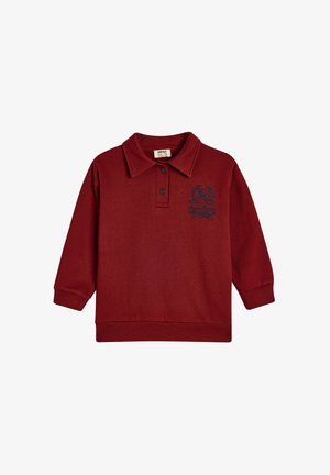 Bordeauxrotes Baumwollpolohemd mit langen Ärmeln, gerippten Bündchen und Kragen; verfügt über ein blaues, gesticktes Logo auf der Brust.