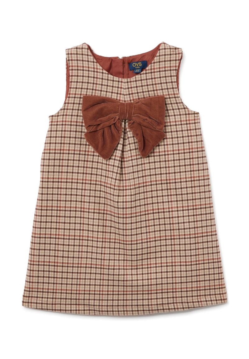 Robe sans manches à carreaux brun et crème avec un grand nœud en velours brun à l'avant et une fermeture éclair à l'arrière. Texture douce.