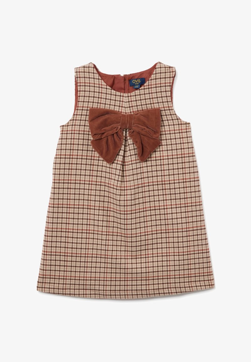Robe sans manches à carreaux brun et crème avec un grand nœud en velours brun à l'avant et une fermeture éclair à l'arrière. Texture douce.