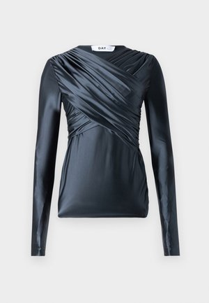 Long-sleeved top in dark navy satin with gathered detailing across the front and smooth texture, featuring a crew neckline and fitted silhouette.