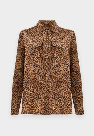Košeľa s leopardím vzorom, golierom, dlhými rukávmi a dvoma náprsnými vreckami. Vyrobená z jemnej látky v hnedých, čiernych a béžových tónoch.