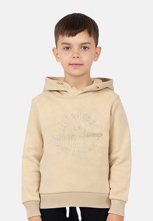 Sweat à capuche beige en tissu doux avec un logo texturé imprimé. Il comporte une poche avant, une capuche avec cordon de serrage, ainsi que des poignets et un ourlet côtelés pour un ajustement parfait.