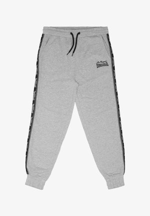 Pantalon de survêtement gris clair avec cordon de serrage noir, poignets élastiques, bandes latérales avec logos Lonsdale, et texte "The Original Lonsdale" sur la cuisse gauche.