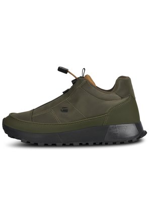 Olive green sneaker with a smooth leather upper, reinforced stitching, rubber sole, and adjustable lacing system. Features black accents.