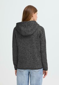 Hooded jack gemaakt van gestructureerde donkergrijze stof, met een relaxte pasvorm, lange mouwen en een licht gebogen zoom.