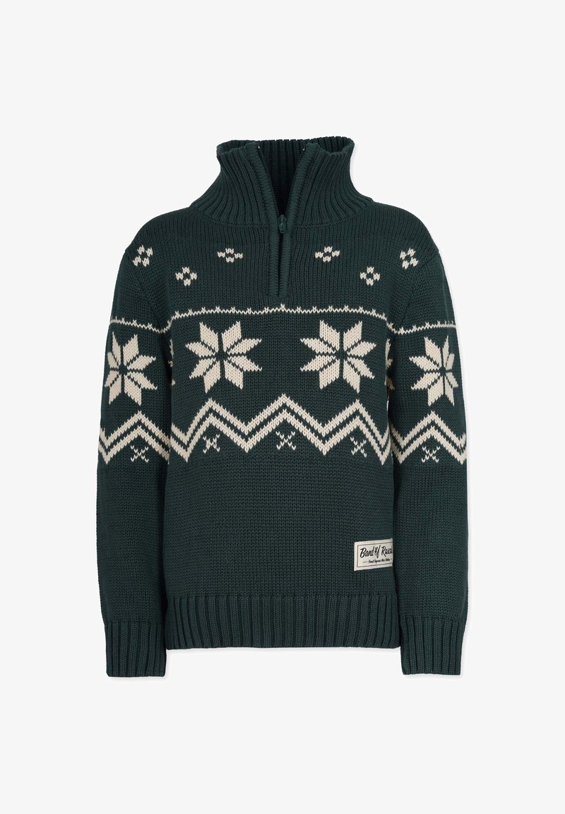 Pull en maille vert foncé avec motifs flocons de neige blancs et zigzag, col côtelé avec une petite fermeture éclair, et une petite étiquette de marque en tissu à l’ourlet.