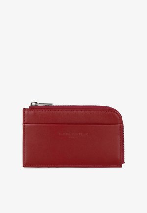 Red leather wallet with a zip closure, featuring a smooth texture and a card slot on the front. Brand name embossed on the surface.