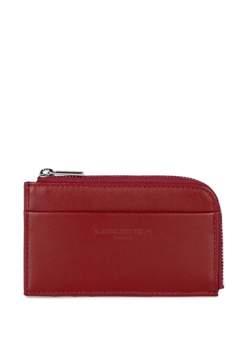 Red leather wallet with a zip closure, featuring a smooth texture and a card slot on the front. Brand name embossed on the surface.