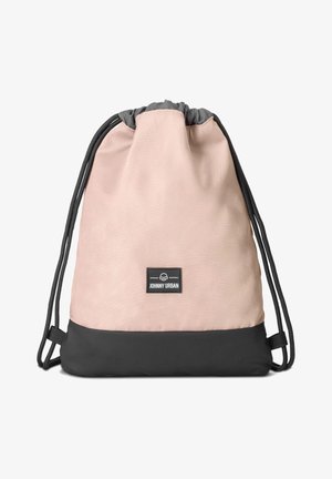 Drawstring backpack in soft pink fabric with a black bottom. Features a logo patch and black adjustable cords for closure and carrying.