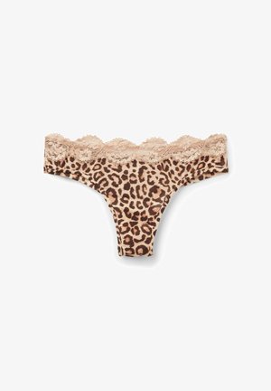 String en imprimé léopard avec une base beige, présentant une bordure en dentelle festonnée le long de la taille et en tissu doux.