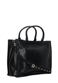 Borsa tote in pelle nera con due manici, una tracolla removibile e dettagli in oro. Texture liscia con un design minimalista.