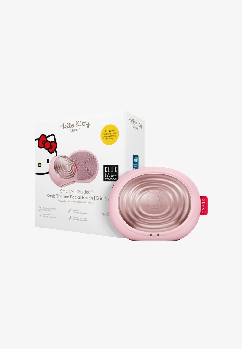 Sonic ansiktsborste med en glänsande rosa plastutsida med en Hello Kitty-design, förpackad i en vit låda med färgglada accenter och text.