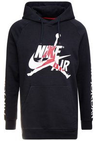 Felpa nera con cappuccio realizzata in tessuto morbido, dotata di tasca a marsupio. Presenta un grande logo Nike Air bianco e rosso sul davanti e testo bianco sulle maniche.